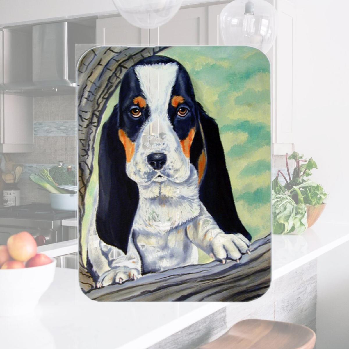 Picture of Carolines Treasures 7002LCB Basset Hound at the tree Glass Cutting Board - Large- 15 x 12 in.