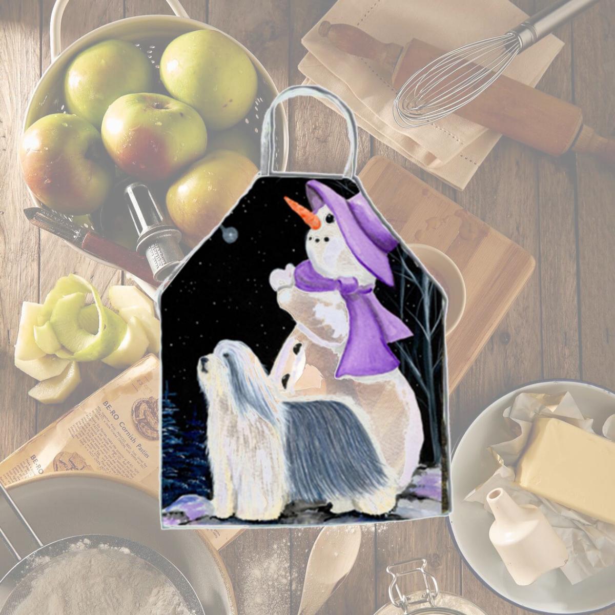 Picture of Carolines Treasures SS8947APRON Snowman with Bearded Collie Apron - 27 x 31 in.