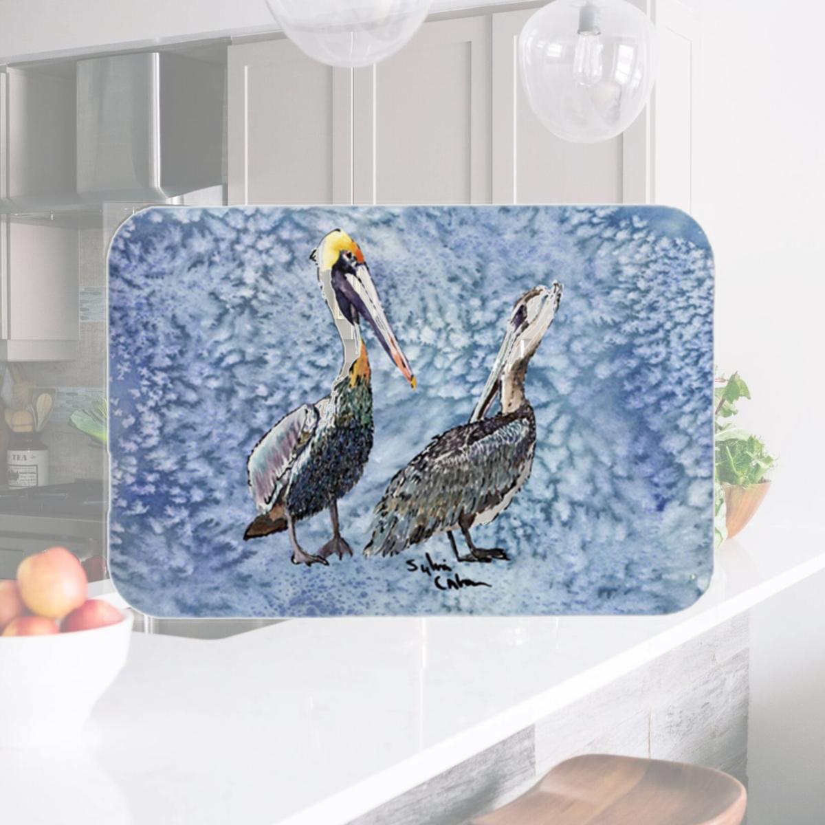Picture of Carolines Treasures 8409LCB 15 x 12 in. Double Trouble Pelicans on Cool Blue Glass Cutting Board