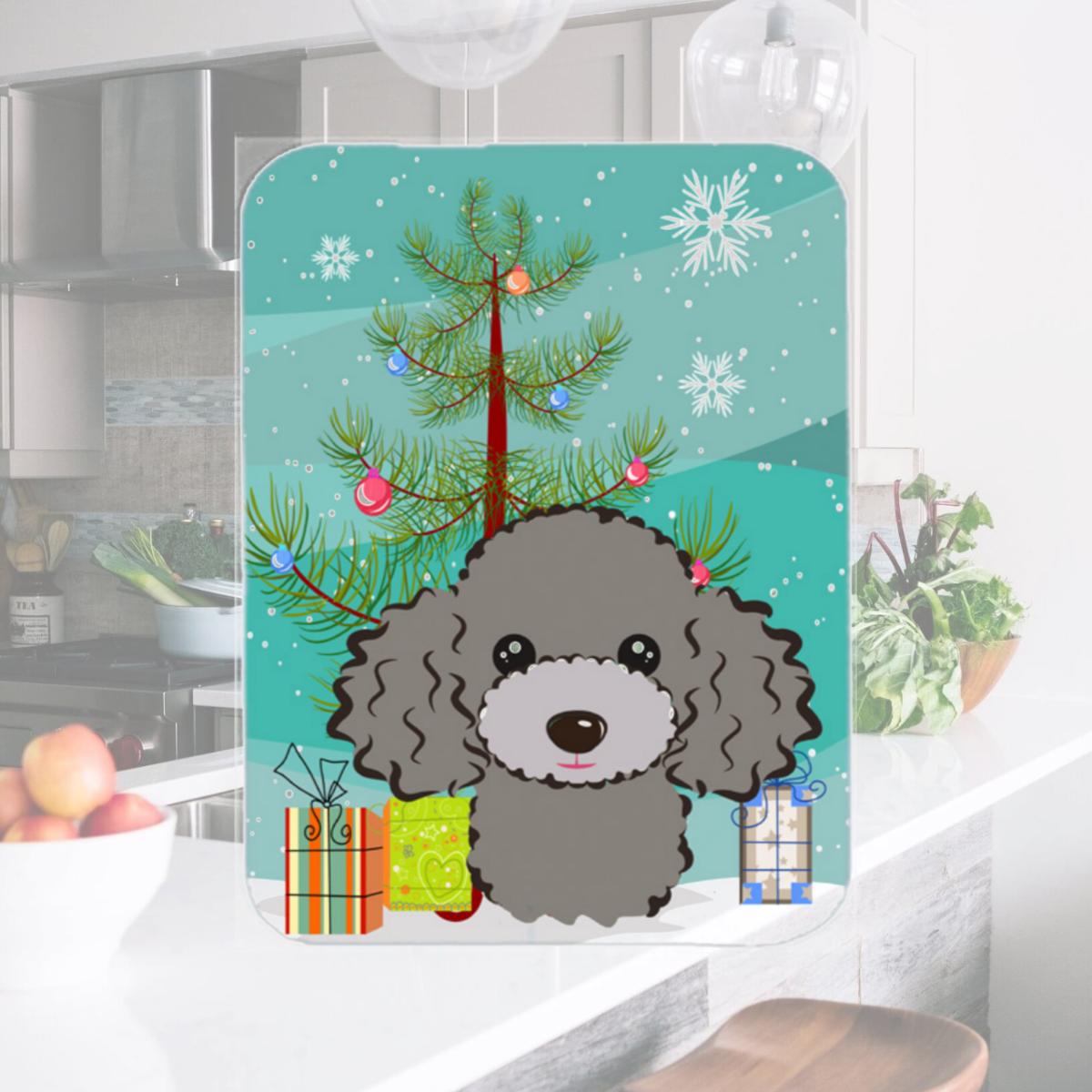 Picture of Carolines Treasures BB1631LCB Christmas Tree And Silver Gray Poodle Glass Cutting Board- Large