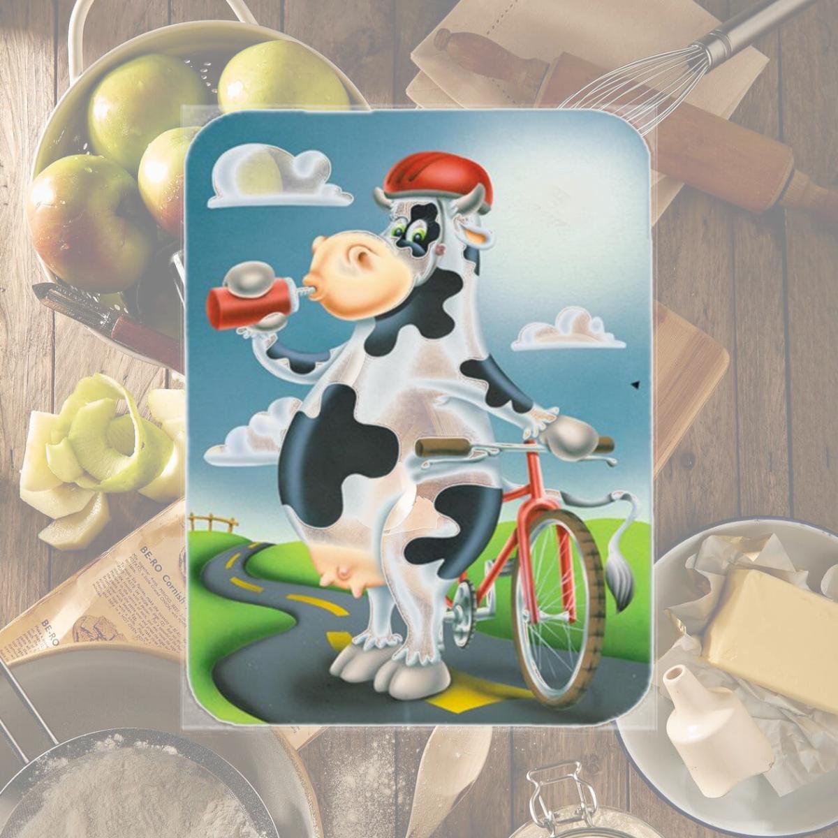 Picture of Carolines Treasures APH0532LCB Cow on a Bike Ride Glass Cutting Board, Large