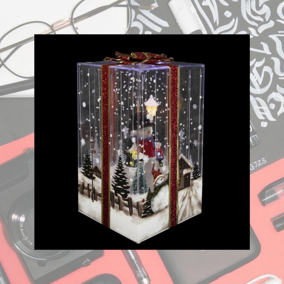 Picture of Northlight 35246967 12 in. Lighted & Musical Snowman Family Snowing Gift Box Christmas Decoration