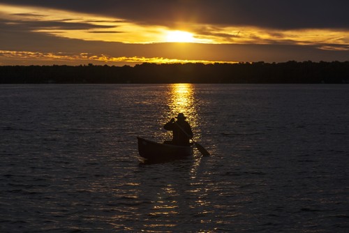 UPC 714224103637 product image for Man Paddling Canoe At Sunrise On Balsam Lake - Ontario Canada Poster Print by Va | upcitemdb.com
