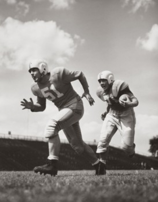 Sal2555424b Two Football Players Running With A Football On A Football Field Poster Print - 18 X 24 In.