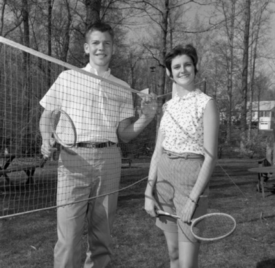 SAL255420783 Young Woman & Young Man Playing Badminton Poster Print – 18 x 24 in.