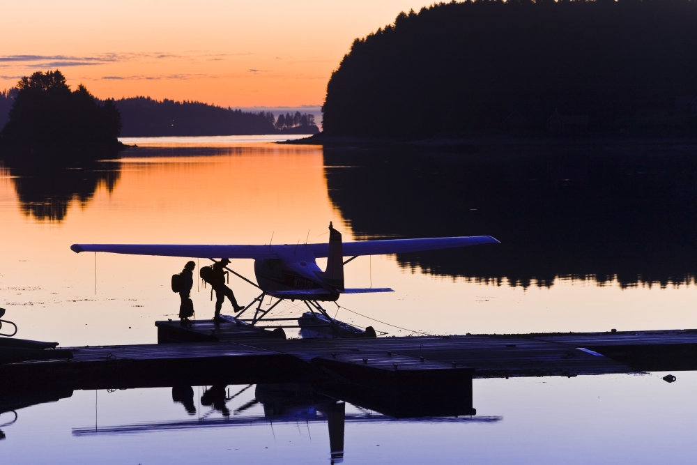 Couple Boarding Small Cessna Plane On Floats At Sunrise At The Trident Basin Seaplane Base On Near Island Kodiak Alaska Poster Print, 17 X 11