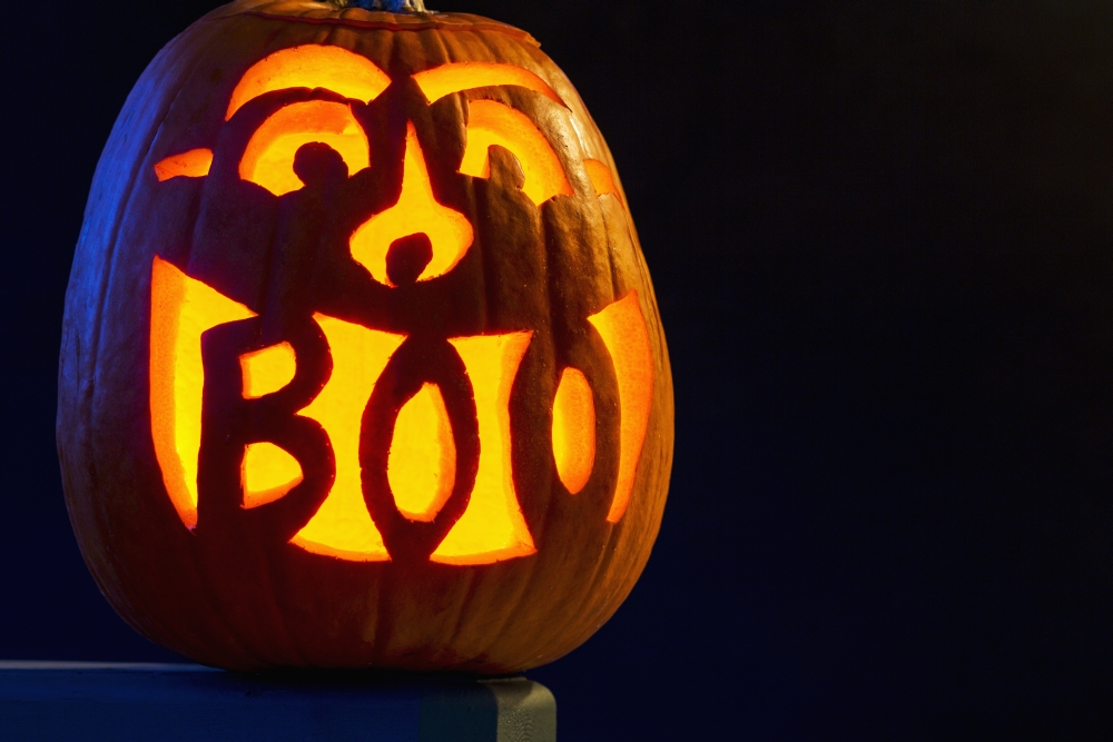 Carved Pumpkin Glowing With The Word Boo Carved In Mouth - Calgary Alberta Canada Poster Print - 38 X 24 In. - Large