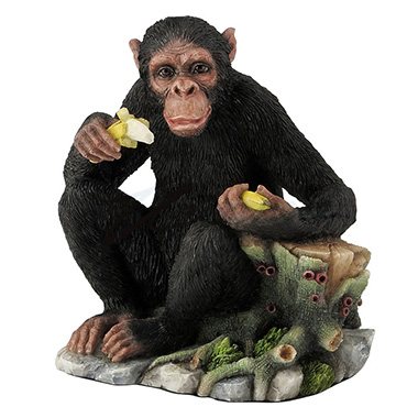 Chimpanzee Eating Bananas By A Tree Stump Sculpture