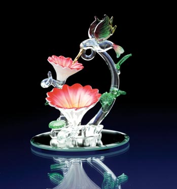 GLASS HUMMINGBIRD OVER FLOWERS