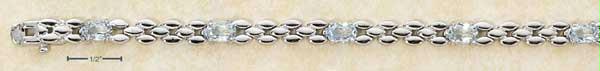 Sterling Silver 7 Inch Narrow Stampato with Seven Oval Blue Topaz Stones Bracelet