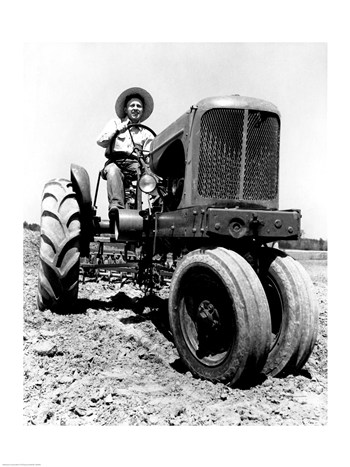Farmer Sitting On A Tractor In A Field 18.00 X 24.00 Poster Print