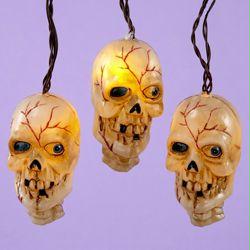 DKSA HW1281 Set of 10 Battery Operated Rotting Skull Musical Novelty Halloween L