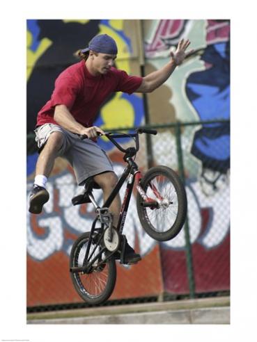 Low Angle View Of A Teenage Boy Performing A Stunt On A Bicycle -18 X 24- Poster Print