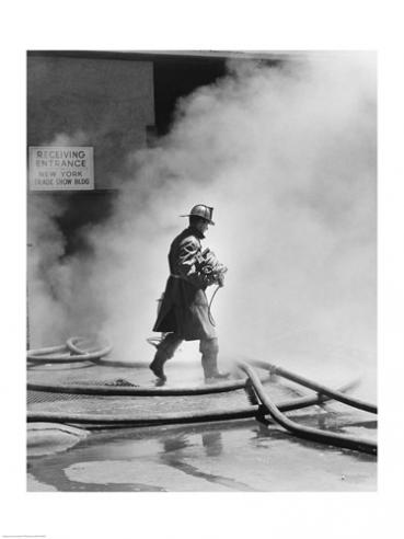 Sal25533070 Firefighter Walking In Front Of Smoke -18 X 24- Poster Print