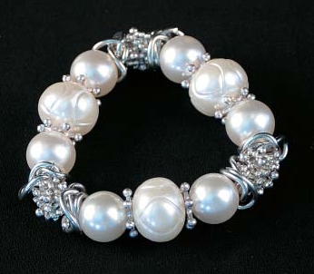 049-40154 Silver Tone And White Beads Stretch Bracelet