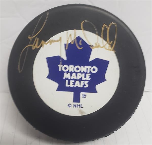 Picture of Autograph Warehouse 783370 Lanny Mcdonald Autographed Hockey Puck - Toronto Maple Leafs Hall Famer with Display Cube