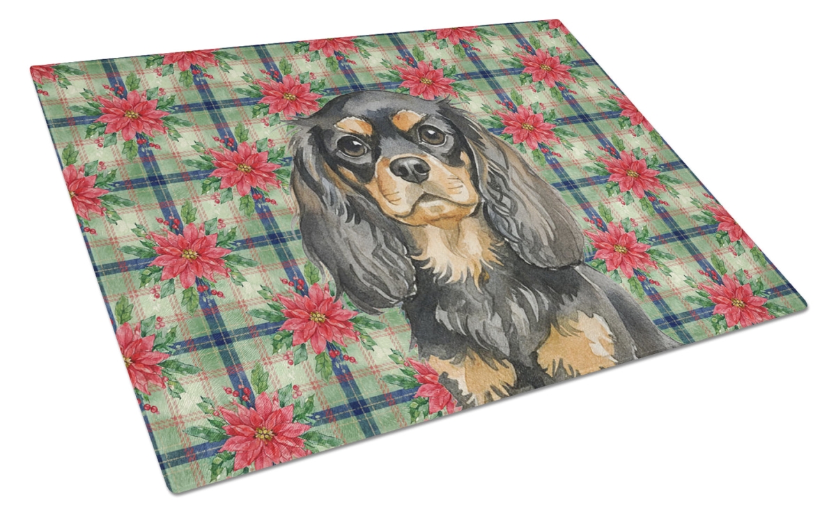 Picture of Carolines Treasures WDK8634LCB Unisex Adult Black & Tan English Toy Spaniel Christmas Poinsettias Glass Cutting Board - 15 x 12 in.