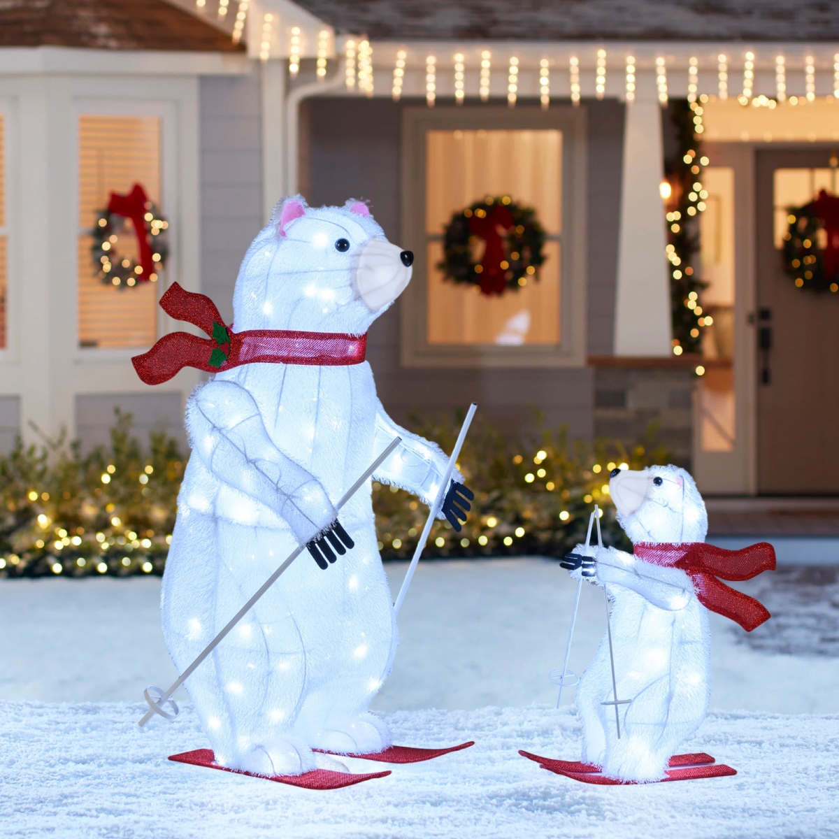 CM25123US Animated Skiing Polar Bears Pre-Lit Christmas Bear Decoration with Skiing Motion, White & Red - 2 Piece