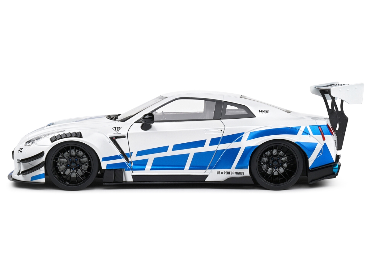 Picture of Solido S1805816 2024 Nissan GT-R R35 Right Hand Drive with Liberty Walk 2.0 Body Kit White Metallic with Blue Stripes for Paul Tribute 1-18 Scale Diecast Model Car