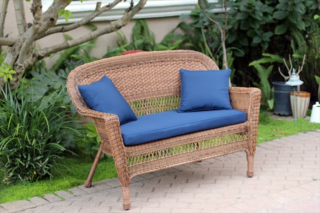 Honey Wicker Patio Love Seat With Blue Cushion And Pillows