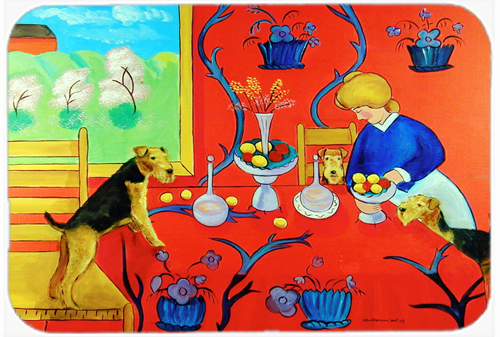 Picture of Carolines Treasures 7212LCB 15 x 12 in. Airedale Terrier with lady in the kitchen Glass Cutting Board- Large
