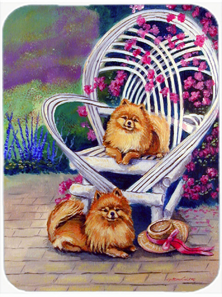Picture of Carolines Treasures 7176LCB 15 x 12 in. Red Pomeranians on the patio Glass Cutting Board - Large