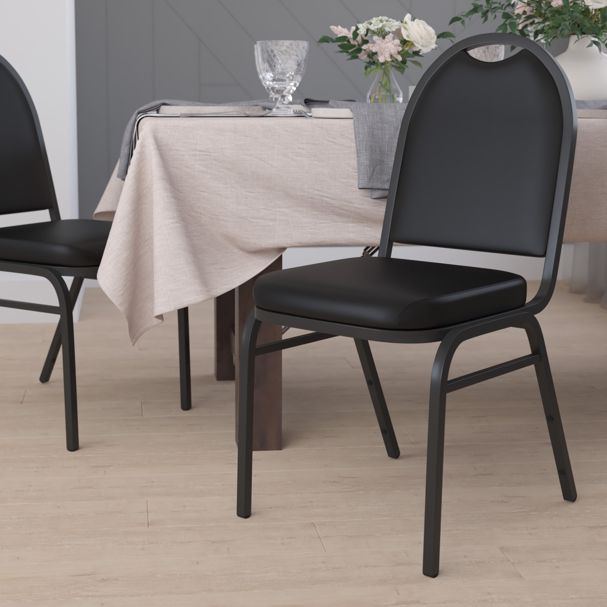 Hercules Series Commercial Grade 500 lbs Capacity Dome Back Stacking Banquet Chair in Black Vinyl with Black Metal Frame