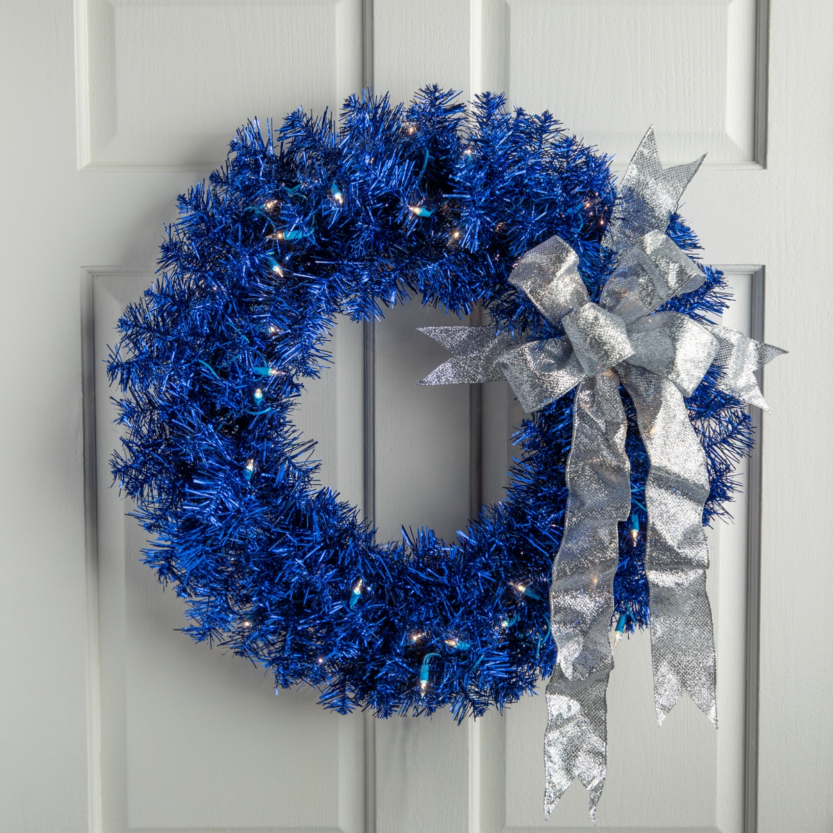 35764363 24 in. Blue Pre-Lit Artificial Tinsel Christmas Wreath - Clear Lights