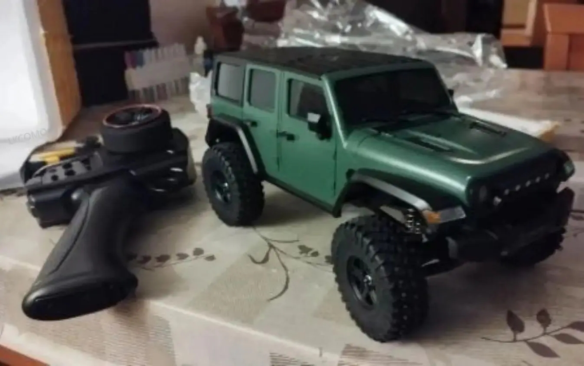 NM61506 2.4G RC CAR Full Scale Model Wrangler Jeep Off-road Model FourWheel Drive Upgraded Shock Absorber Three Gear Cars Toy