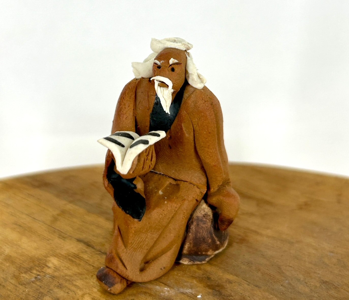 e1875a Miniature Ceramic Figurine with Mud Man Reading Book - 1.75 in.