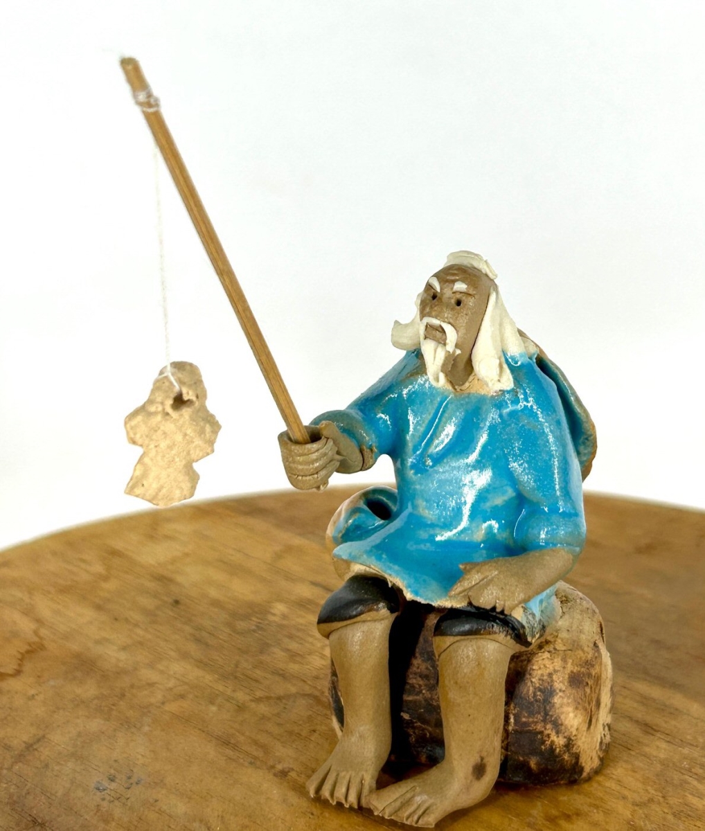 e3602 Miniature Ceramic Glazed Fisherman Figurine with Sitting On A Log, Light Blue - 2.5 in.