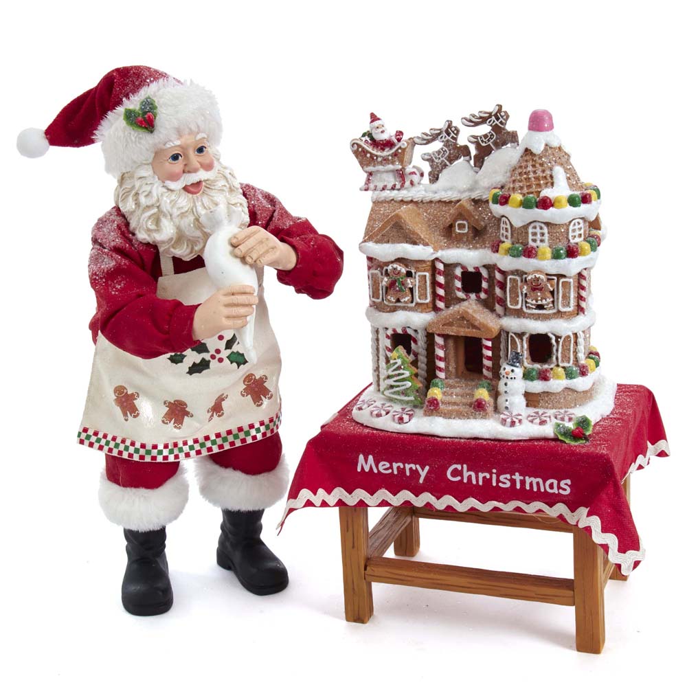 10.5 in. Battery-Operated Fabriche Santa Decorating LED Gingerbread House Table Piece