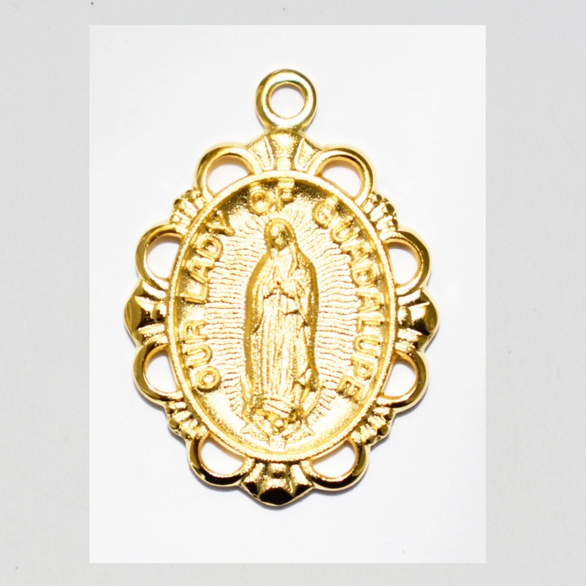 0.77 x 0.55 x 0.6 in. Gold on Sterling Silver Lady of Guadalupe Medal