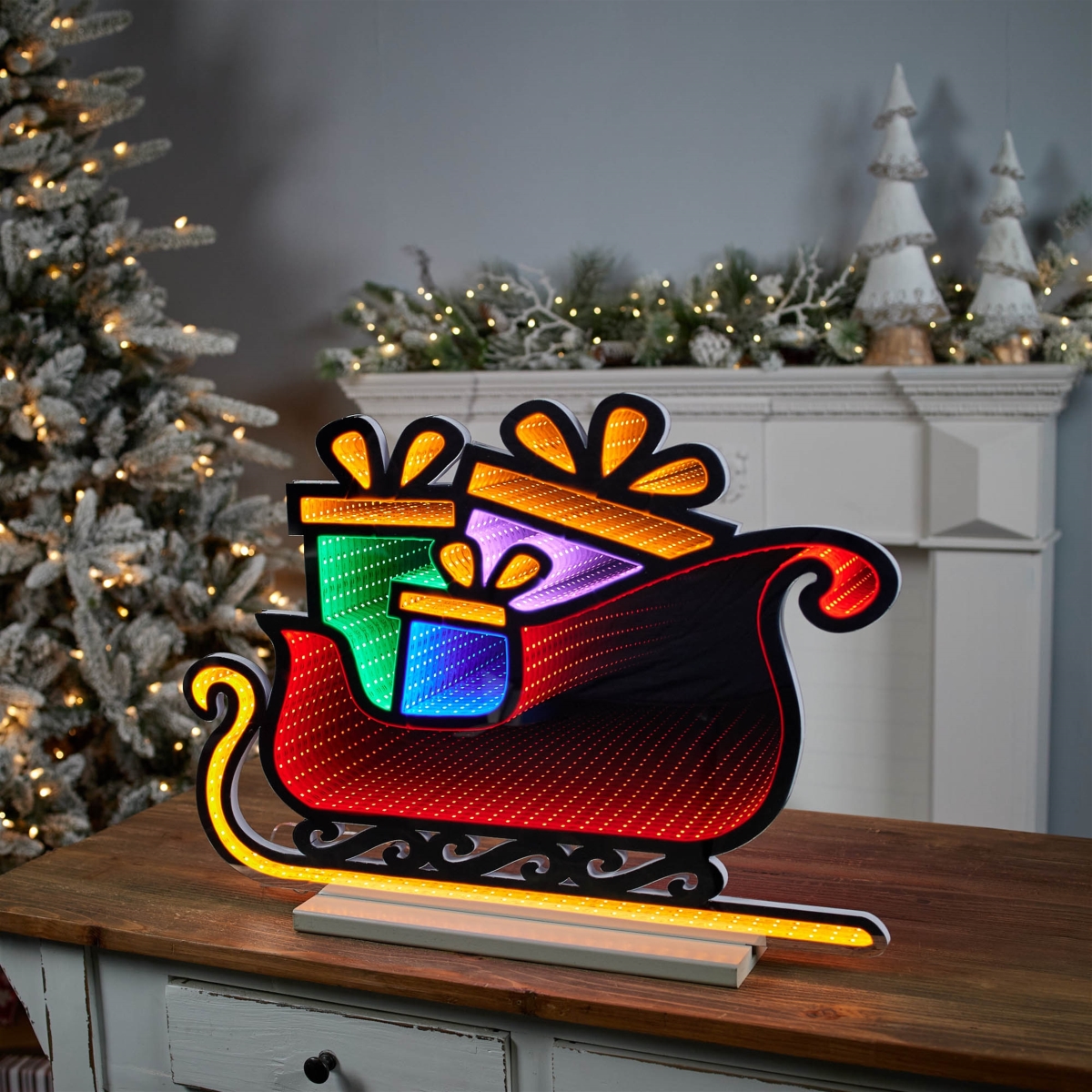 Picture of Melrose 95916DS 24.5 x 18 in. Acrylic UL Plug Sleigh with Packages Ekkolight&#44; Red&#44; Orange & Green