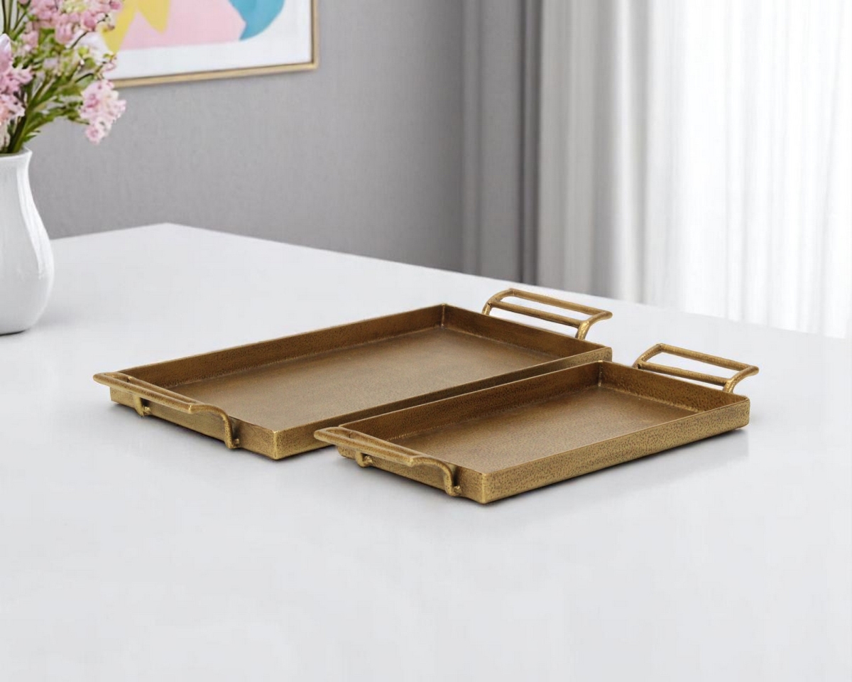Picture of HomeRoots 625656 1.375 x 17.75 x 8.125 in. Gold Cast Iron Handmade Rectangular Vanity Trays with Handles - Set of 2