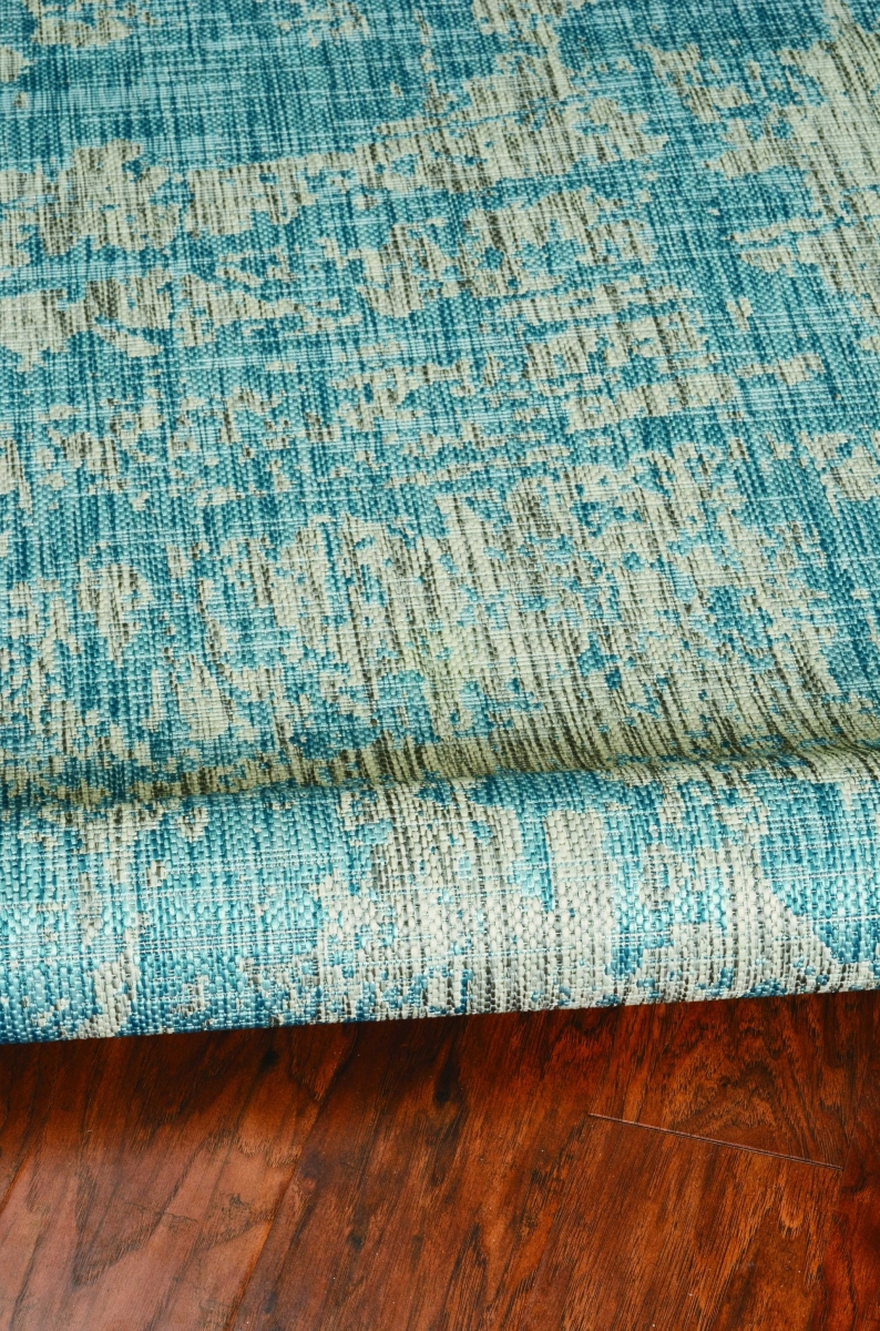 5 ft. 3 in. x 7 ft. 7 in. Teal Polypropylene Rug