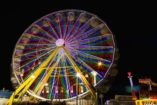 Colourful Lights of A Moving Ferris Wheel At Nighttime - Calgary Alberta Canada Poster Print - 38 x 24 - Large