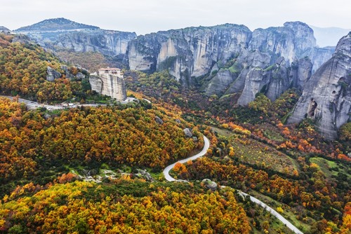 Monastery Perched On A Cliff with Autumn Coloured Foliage - Meteora Greece Poster Print