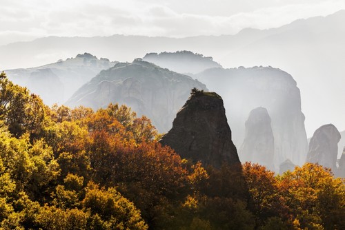 DPI12286685 Low Cloud Around The Rugged Cliffs with Foliage in Autumn Colours - Meteora Greece Poster Print by Reynold Mainse, 19 x 12