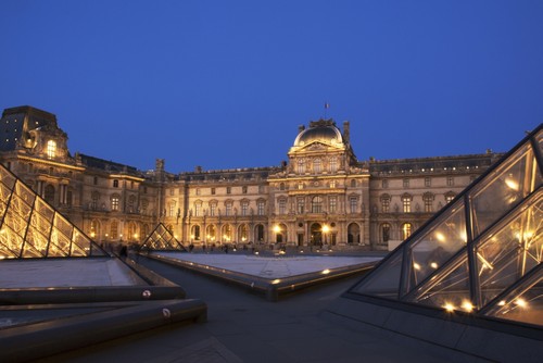 DPI12286425 Le Louvre Palace Buildings & Pyramids At Night in Golden Light - Paris France Poster Print by Philippe Widling, 19 x 12 -  Posterazzi