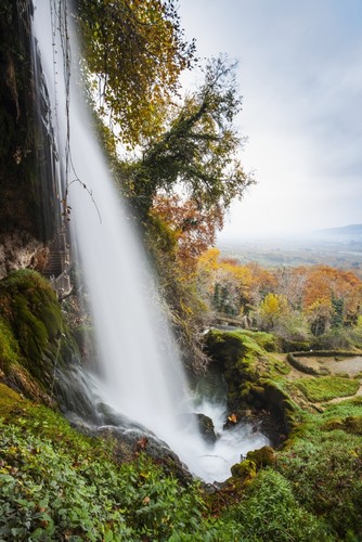 DPI12286698 Waterfall from The Edessaios River with Autumn Coloured Foliage - Edessa Greece Poster Print by Reynold Mainse, 12 x 19