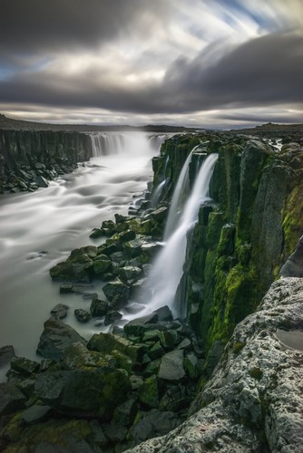 DPI12296394 Waterfall Flowing Over Moss Covered Cliffs - Selfoss Iceland Poster Print by Robert Postma, 12 x 19