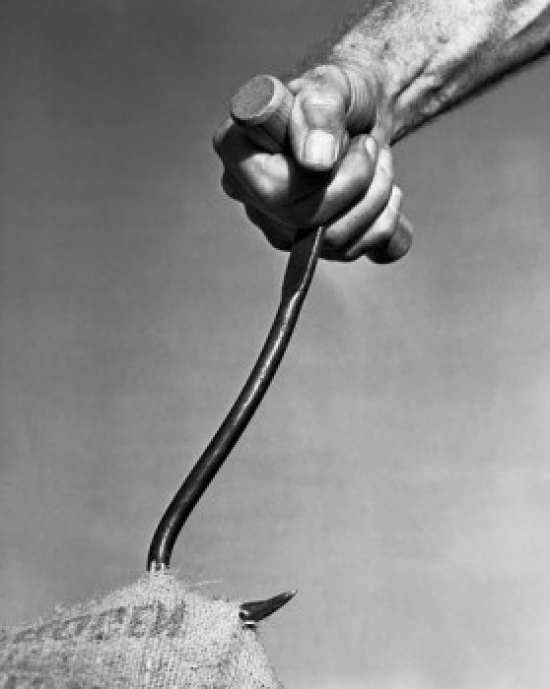 Close-Up of a Mans Hand Pulling a Sack by a Hook Poster Print - 18 x 24 in.