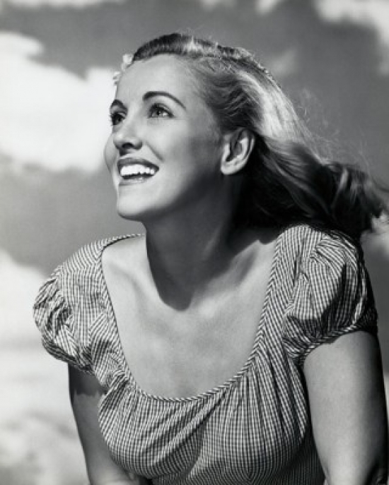 Young Woman Looking Up & Smiling Poster Print