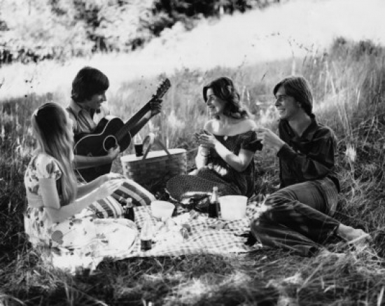 Two Young Couples Sitting in a Park Poster Print - 18 x 24 in.
