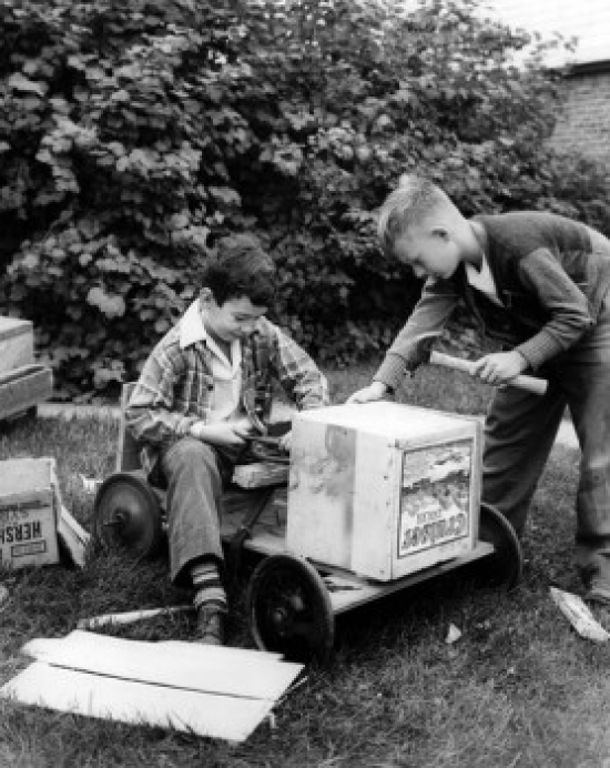 Boys Constructing Toy Car Poster Print - 18 x 24 in.