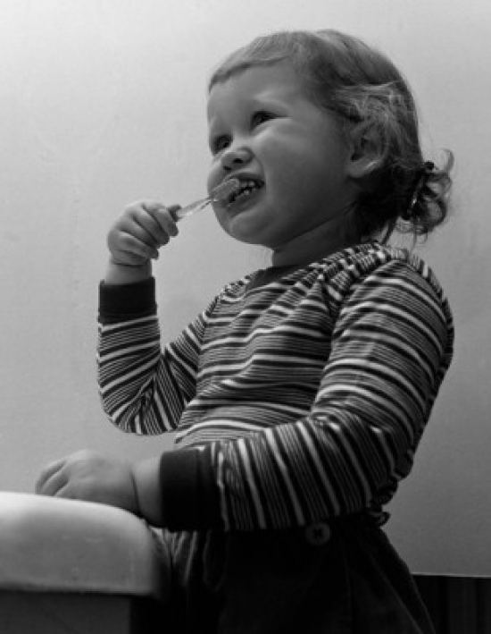 Small Girl Brushing Teethes Poster Print - 18 x 24 in.