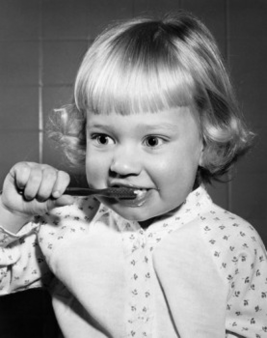 Girl Brushing Teeth Poster Print - 18 x 24 in.