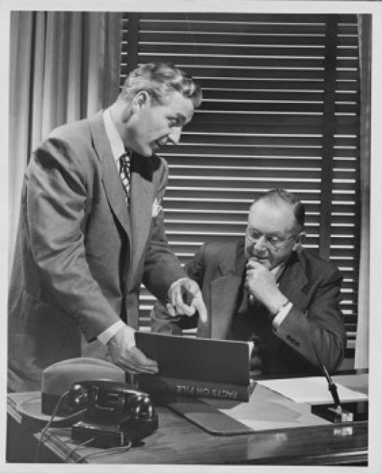 Two Businessmen Talking to Each Other in an Office Poster Print