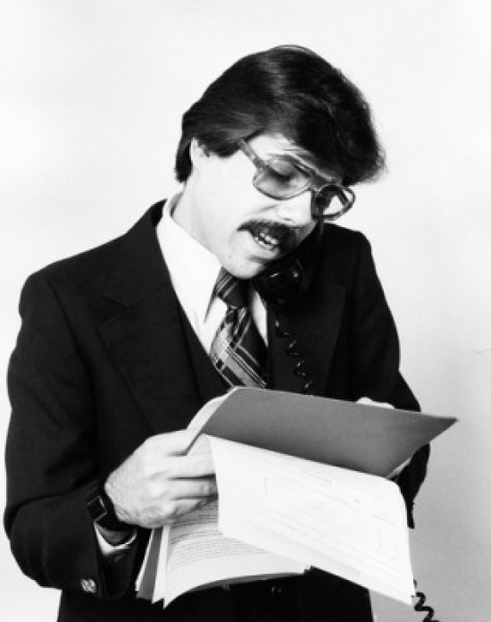 Close-Up of a Businessman Talking on the Telephone Poster Print - 18 x 24 in.